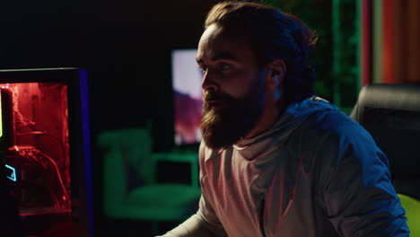 furious gamer smashing keyboard on head after losing online competitive multiplayer match