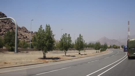 highway road in medina with rocky mountain or hills on the side