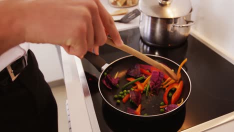 man preparing a food in kitchen