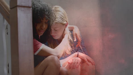 animation of lightning storm over sad diverse teenage girls comforting each other on stairs