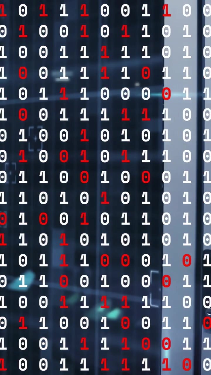 Vertical video: Binary overlay static as cam panning right, racks showing, LED pulsing, showing net