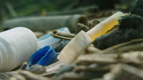 close up shallow focus shot of washed up plastic on the beach