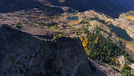 Aerial---Flying-over-Mountain-Revealing-stunning-background-landscape-and-Lakes-in-Big-Cottonwood-Canyon-Utah