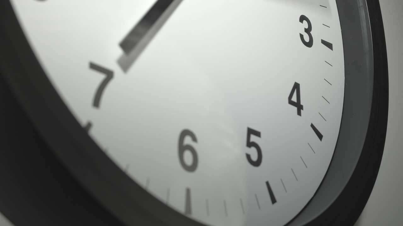 Clock Face in Time Lapse on White Wall in Office