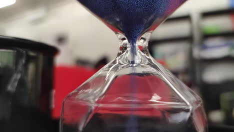 close up shot of hourglass countdown indoors