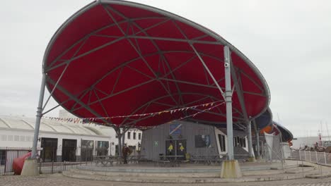 outdoor structure with red canopy