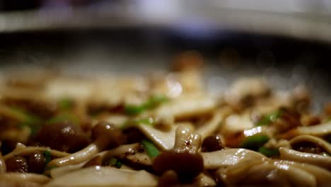 delicious mushrooms cooked and steaming in a hot skillet