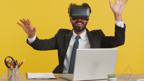 excited business man using virtual reality 3d simulation headset watching video play game working