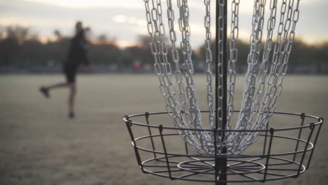 Shallow-Depth-of-Focus-Slow-Motion-Missed-Disc-Golf-Shot-that-Hits-the-Chains-but-doesn't-Go-in-the-Disc-Golf-Basket