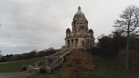 aerial view landmark historical copper dome building ashton memorial english countryside low descending shot