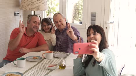 family taking a selfie together at home
