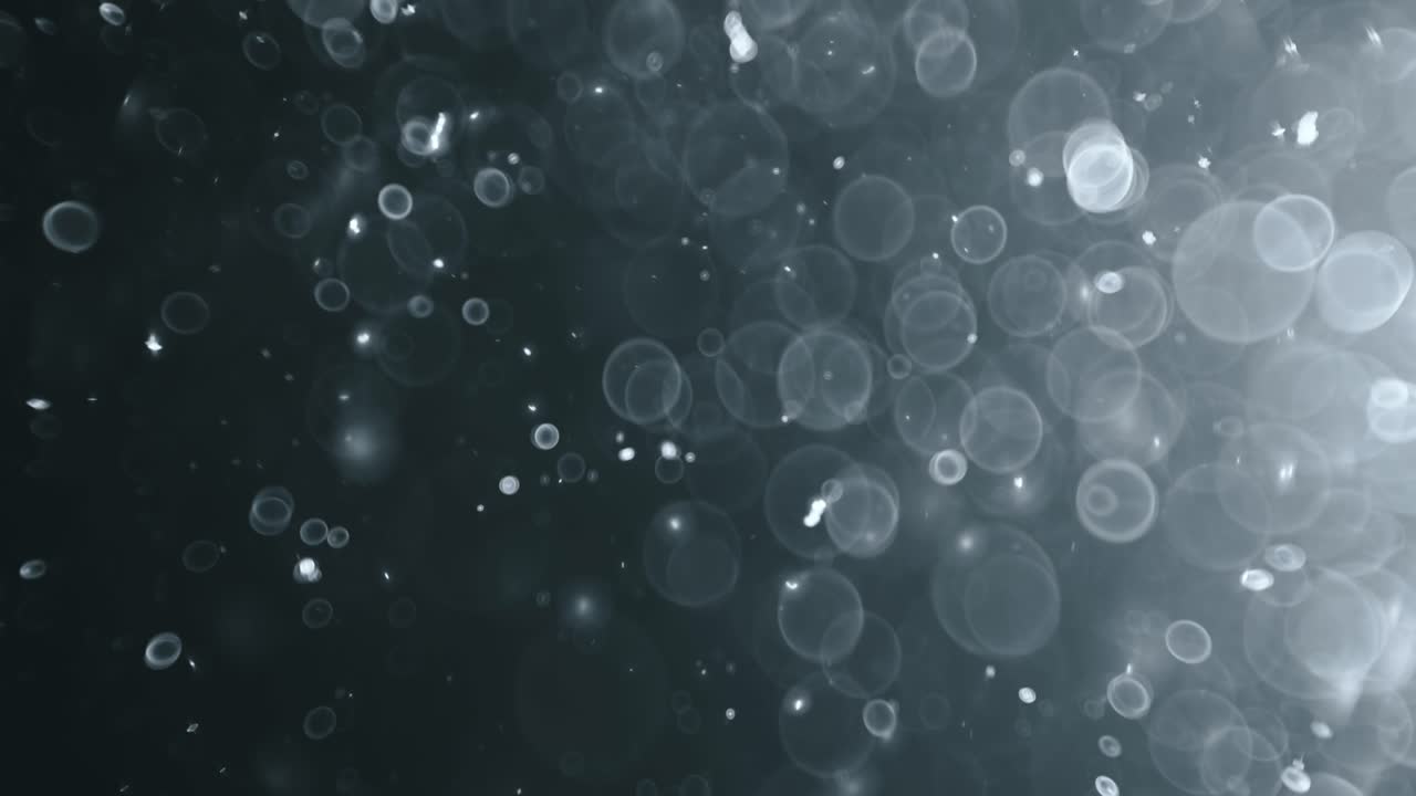 bokeh de partículas abstractas flotantes sobre fondo oscuro