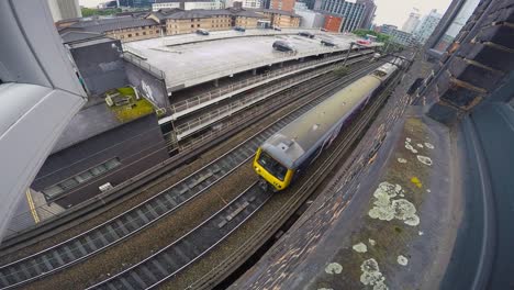 Train-travelling-past-on-tracks-bellow-window-2