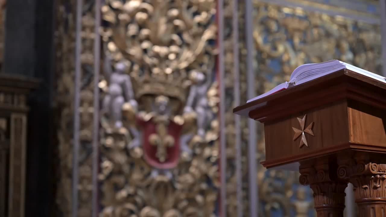 A beautifully detailed Bible rests inside St John’s Co-Cathedral, symbolising devotion, scripture, and the sacred artistry of Maltese religious heritage