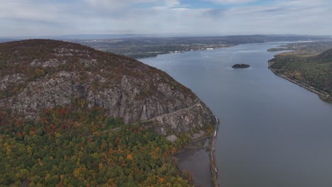 an aerial view over the mountains in upstate ny during the autumn fall foliage change, on a beautiful day