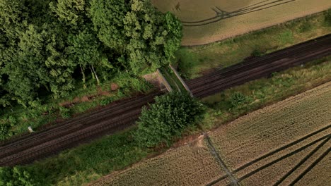 Old-Rusted-Railways-Through-Farm-Field-In-Warminster,-UK