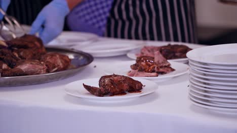 waiter serving plates of food. waiter carrying plates with meat on festive event
