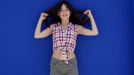 smiling happy young woman holding her hair