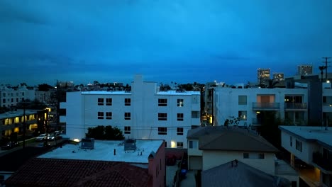 early morning of blue hour sky in century city aerial rising above apartments