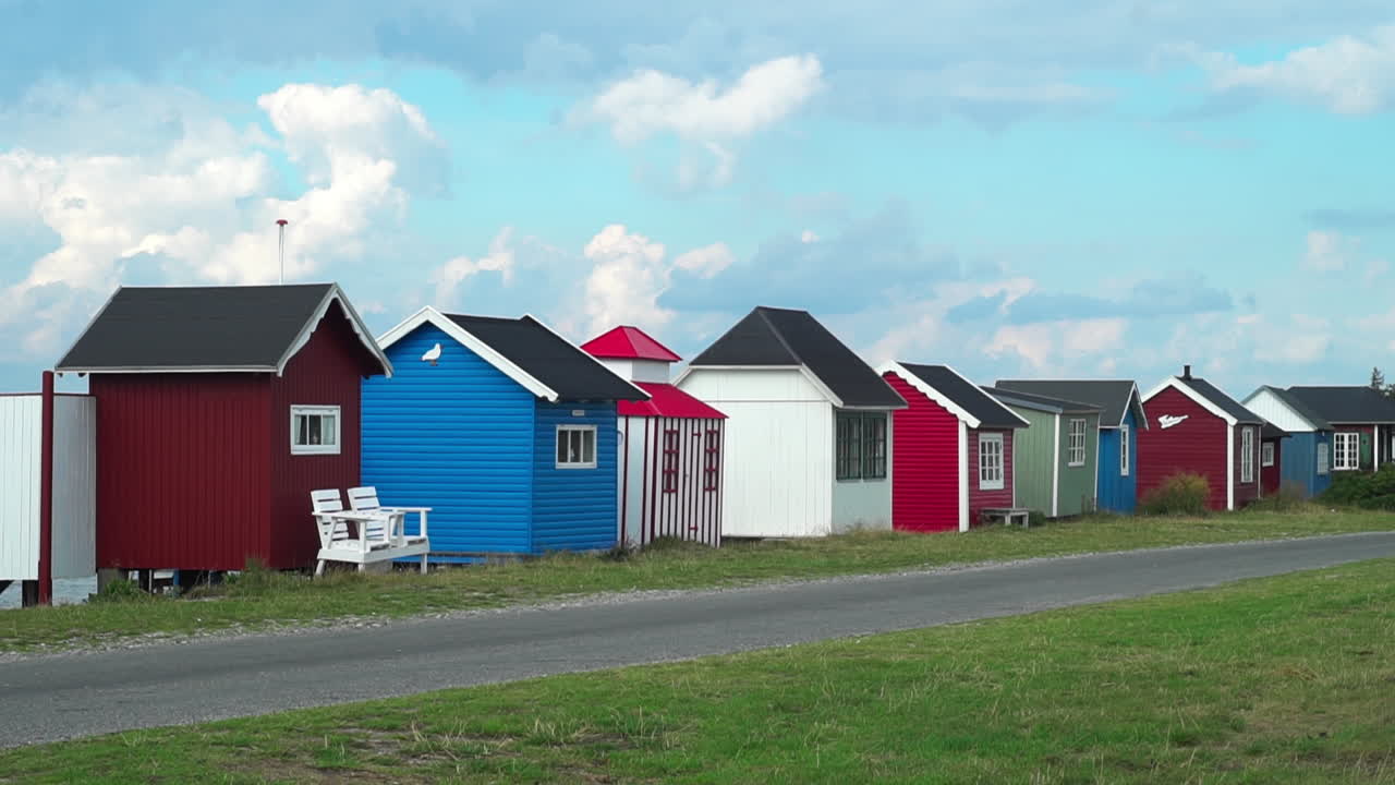 Row of vibrant beach houses on Ærø's peaceful shore