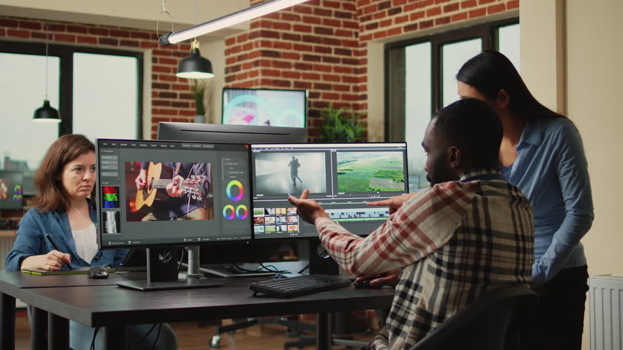 Diverse videographers editing creative film montage on software