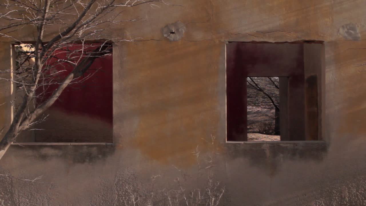 Close shot of a yellow house with red interior in the ghost town of Puerto , in northern Guajira, Colombia
