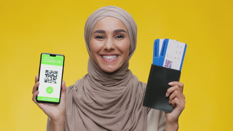 woman with vaccination pass and boarding pass
