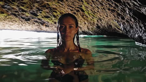 woman swimming in cave