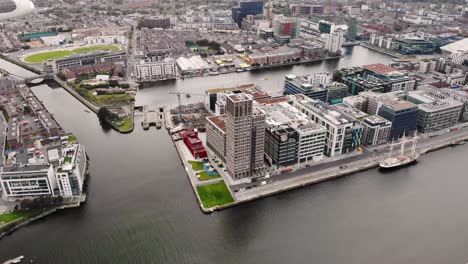 Capital-Dock-aerial-drone-fly-birds-eye-shot-of-the-tallest-building-in-Dublin-city-centre,-Ireland