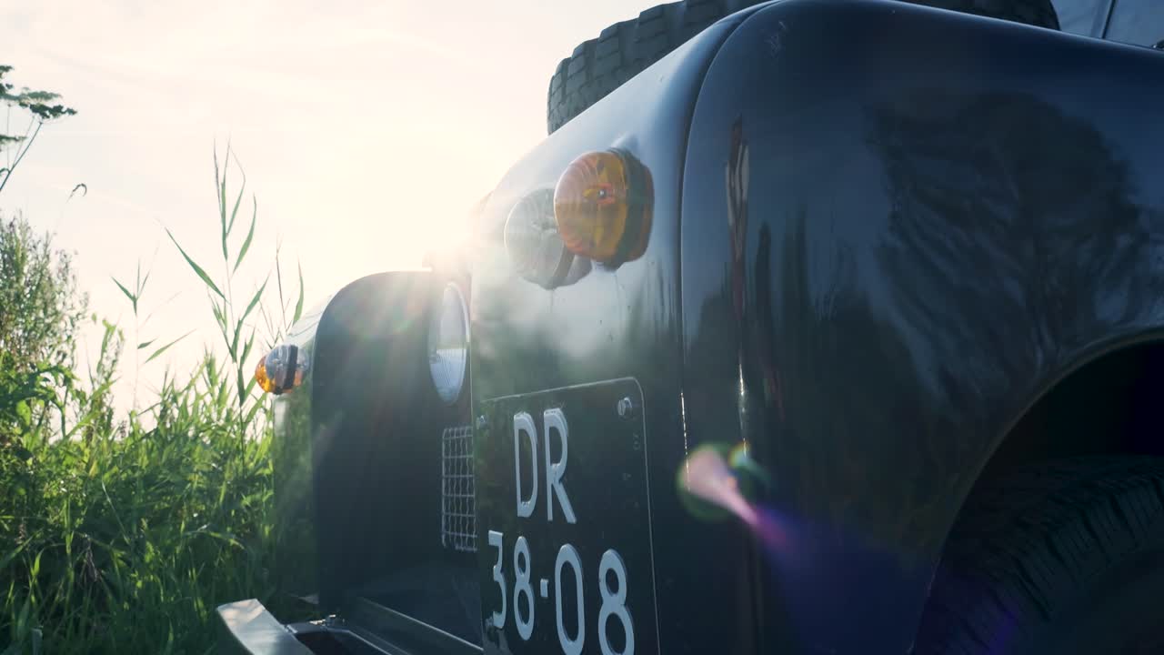 Land Rover in a Field at Sunrise/Sunset