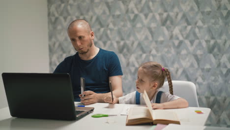 young serious father works at home