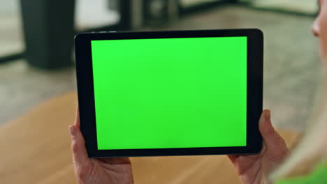 greenscreen pad entrepreneur hands holding close up. woman reading mockup screen