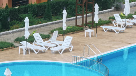 beautiful luxury umbrella and chair around outdoor swimming pool