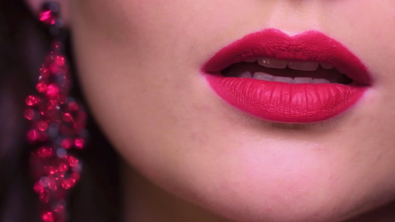 A Close-Up Exploration of Bold Red Lips and Glamorous Earrings, Capturing the Essence of Beauty and Elegance in Fashion Photography