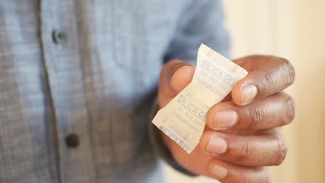 person holding a silica gel packet