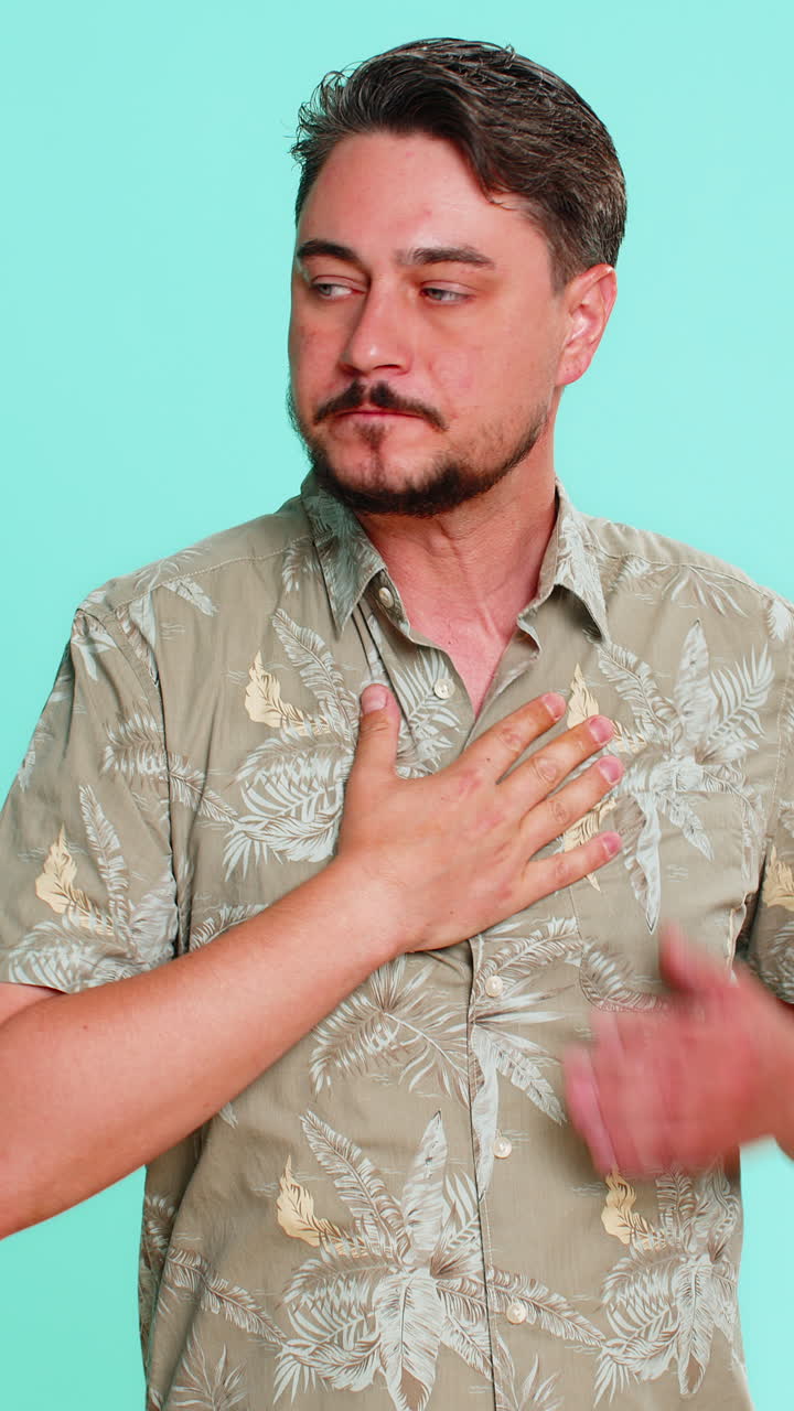 Man breathing through mouth rubbing chest with discomfort showing symptoms of difficulty breathing