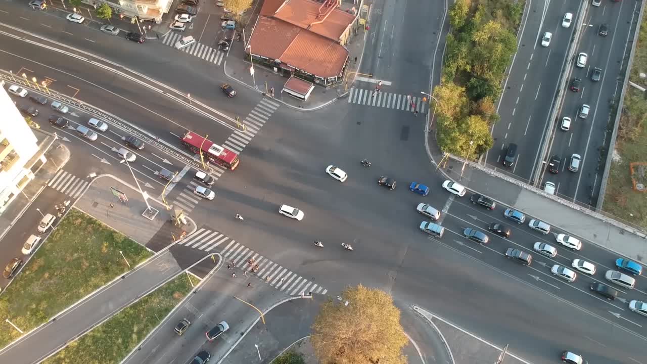 Car traffic moving on a crossroad, steady drone