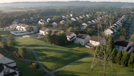 aerial of power electricity wire lines beside neighborhood homes in usa