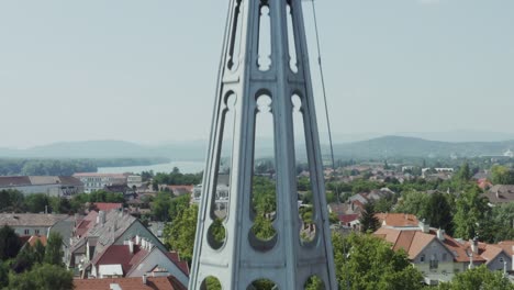 closer view and high altitude drone view from a cityside temple and its tower part