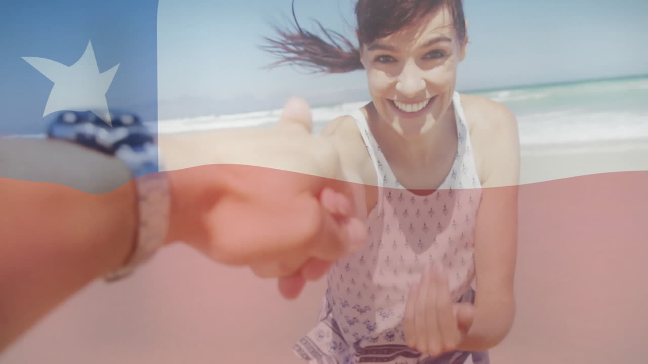 Holding Chilean flag, woman smiling on beach with hand extended, animation overlay