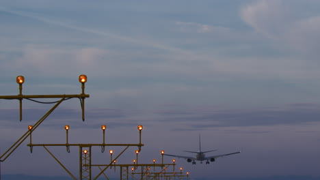 airplane landing at dusk