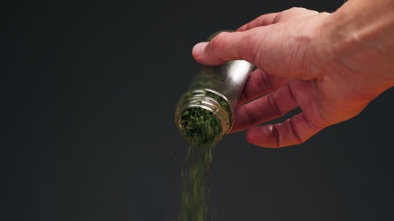 Dried green dill close-up macro. Spice for food. Man hand strewing dill on food . High quality 4k footage