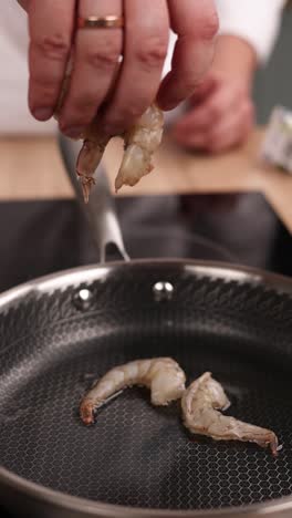 cooking shrimp in a pan