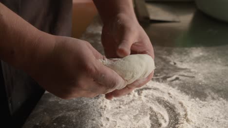 kneading dough with hands for pie in closeup, homemade pastry, handheld shot