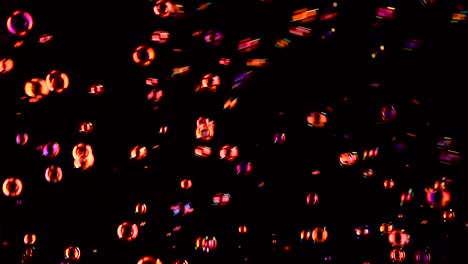 soap bubbles of red color fly black background soap bubbles of red color fly and burst in the air black background