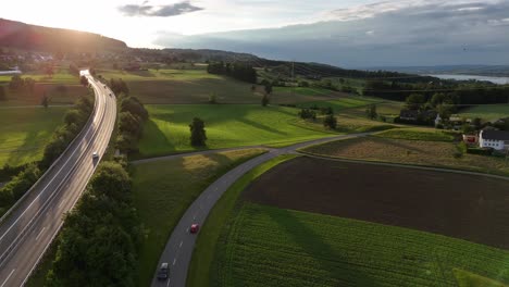 Greifensee,-Suiza,-Mostrando-Exuberantes-Campos,-Carreteras-Y-Paisajes-Escénicos-Al-Atardecer,-Vista-Aérea