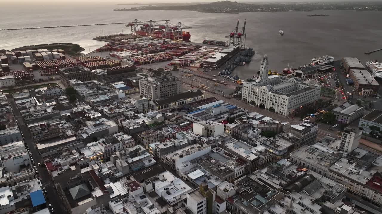 Aerial View of a Bustling Port City with Shipping Containers and Historic Buildings