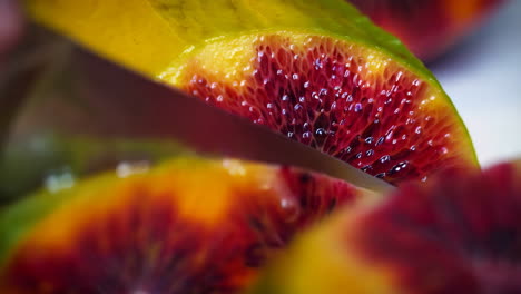 slicing a red kiwi