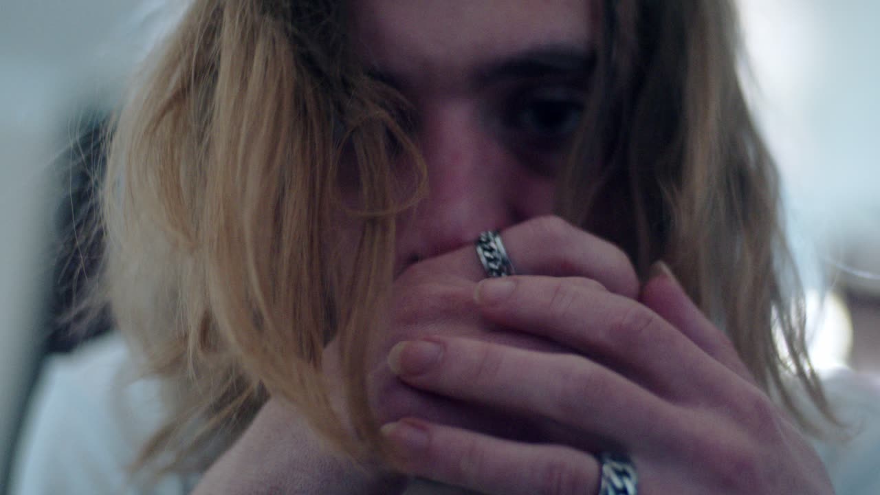 Close-up Portrait of a Young Man with Long Hair