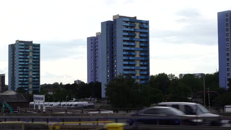driving by large buildings on highway